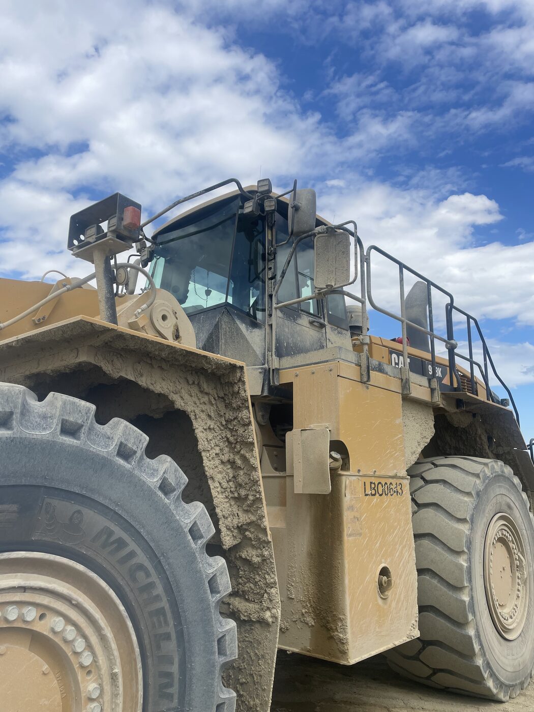 Large Cat wheel loader in for cab glass