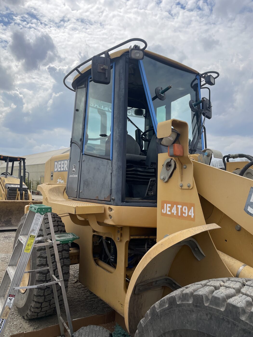 John Deere loader cab with door glass replaced on site