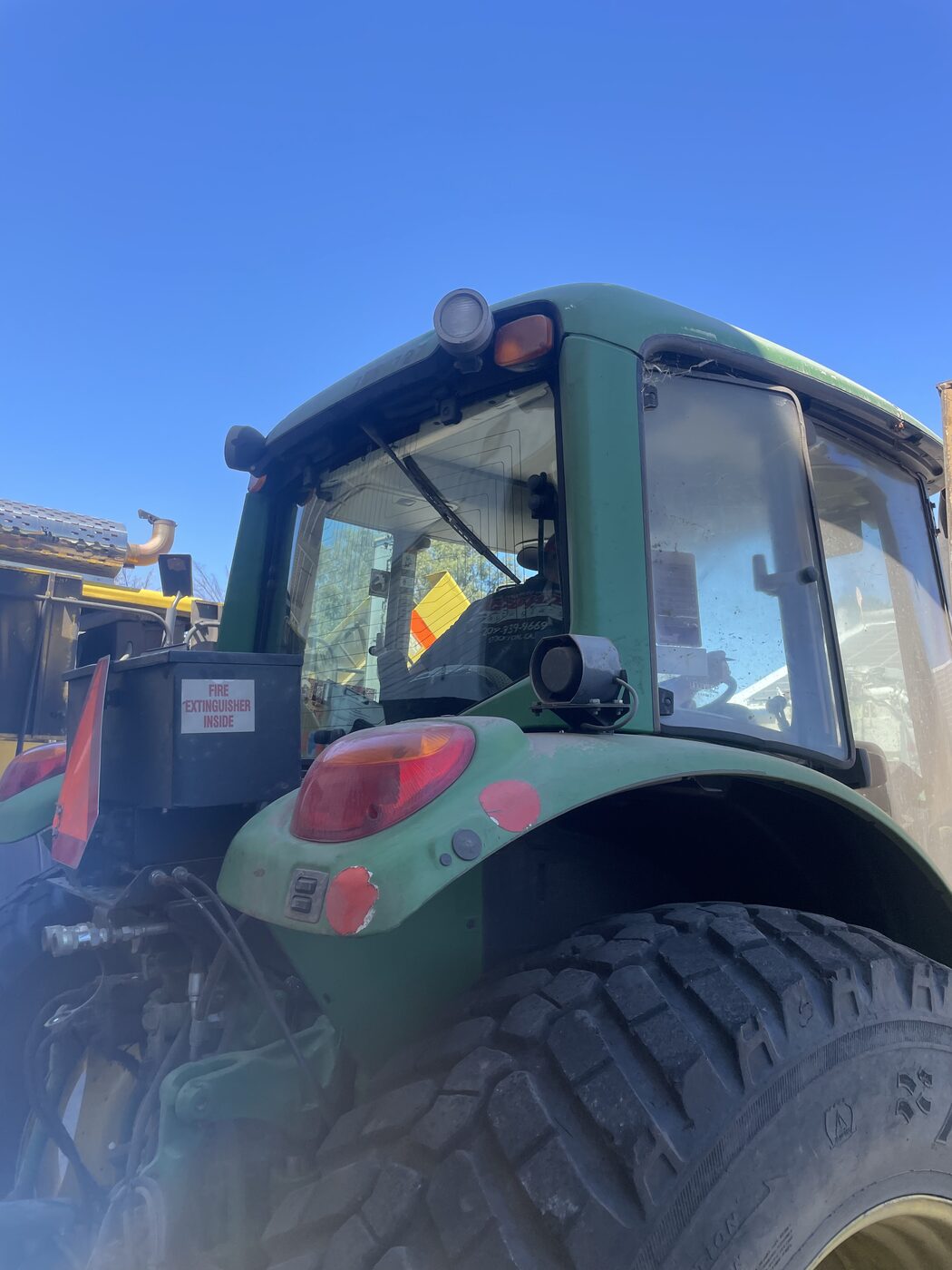 John Deere farm tractor cab glass