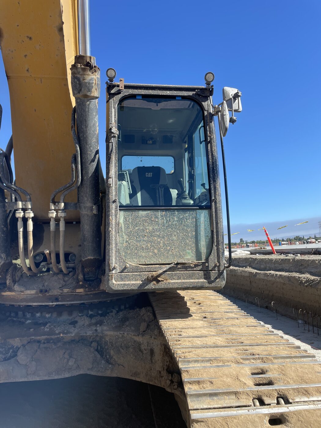 Excavator cab glass on a job site
