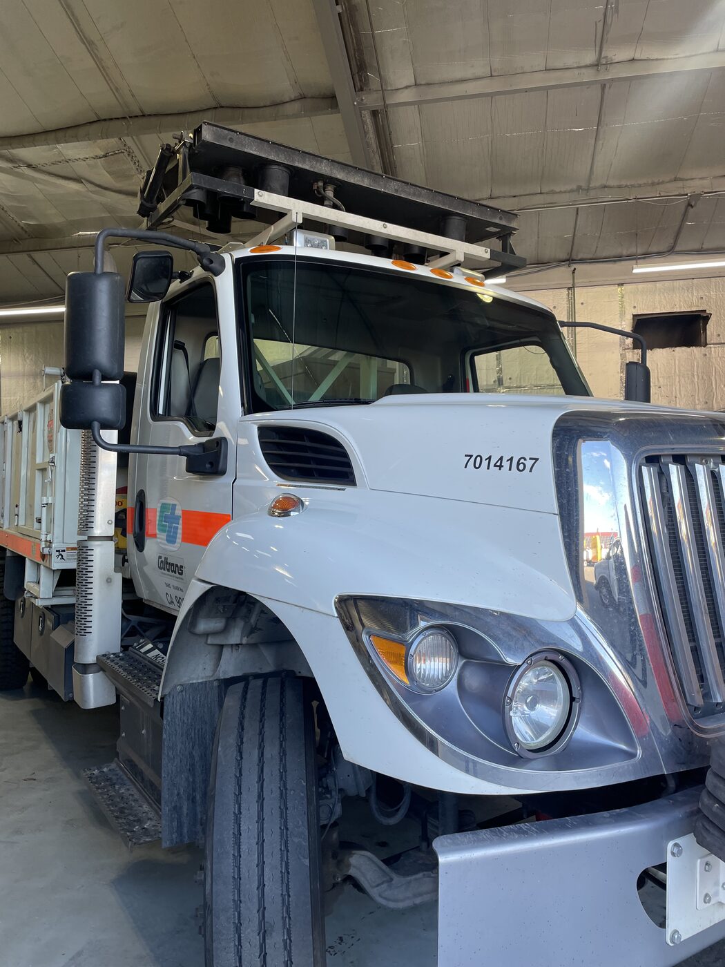 An International work truck in the shop for glass